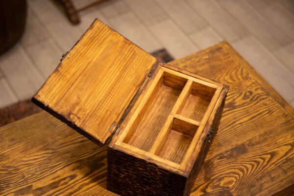 Storage box with a secret drawer